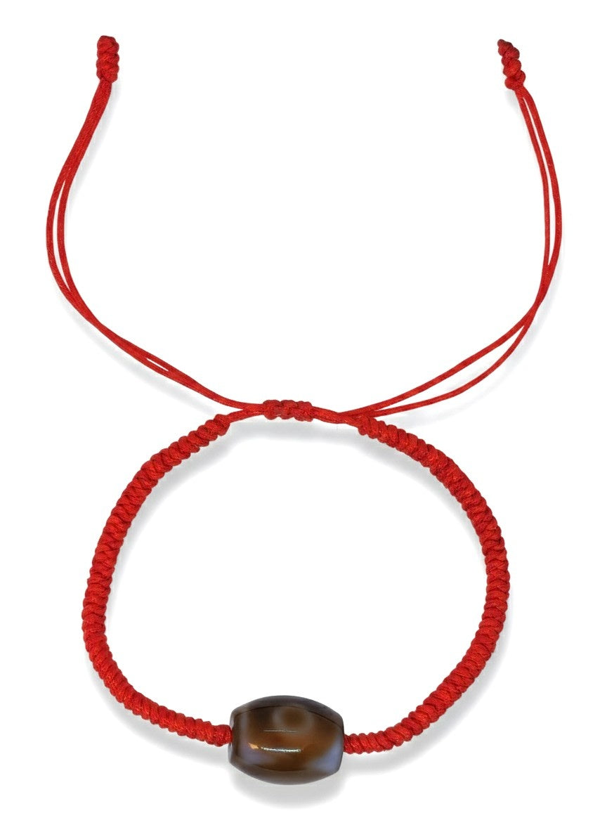 Bracelet porte-bonheur tibétain rouge perle dzi tressé à la main